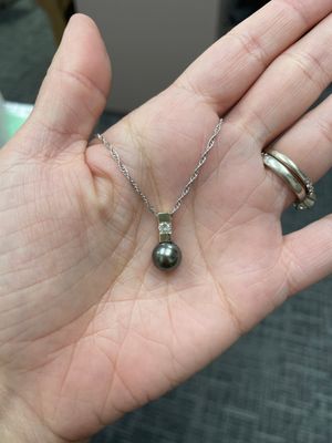 black pearl and diamond necklace in 14K white and yellow gold