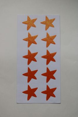Stickersheet met oranje glitter sterren