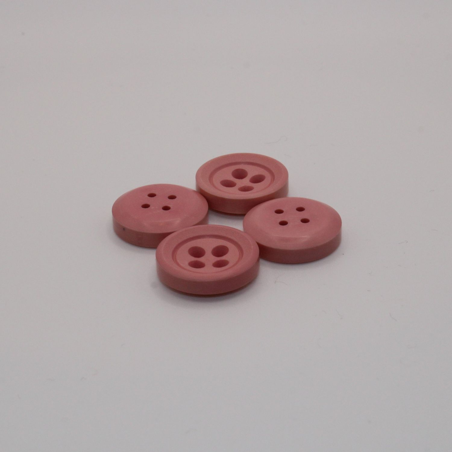 Set van 4 roze knopen