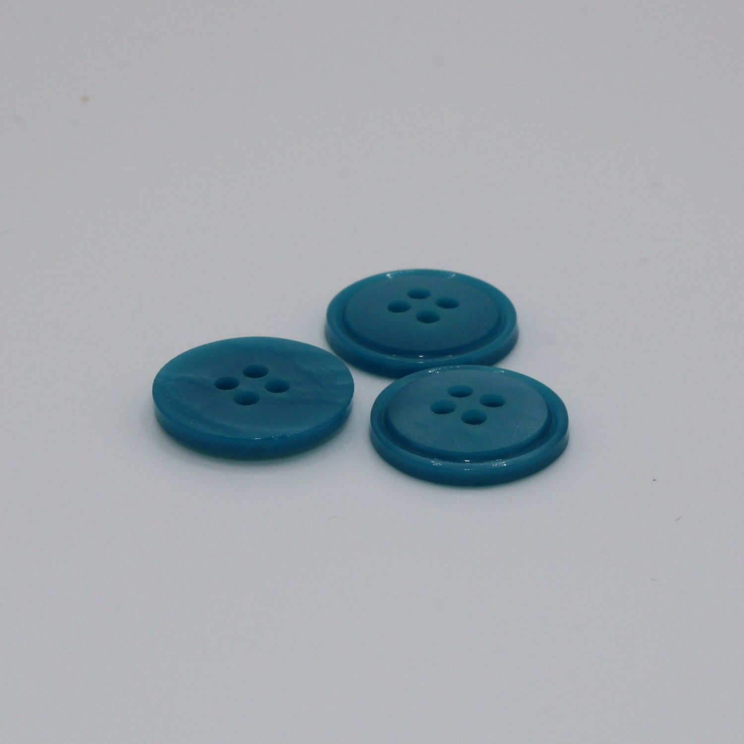 Set van 3 blauwgroene knopen