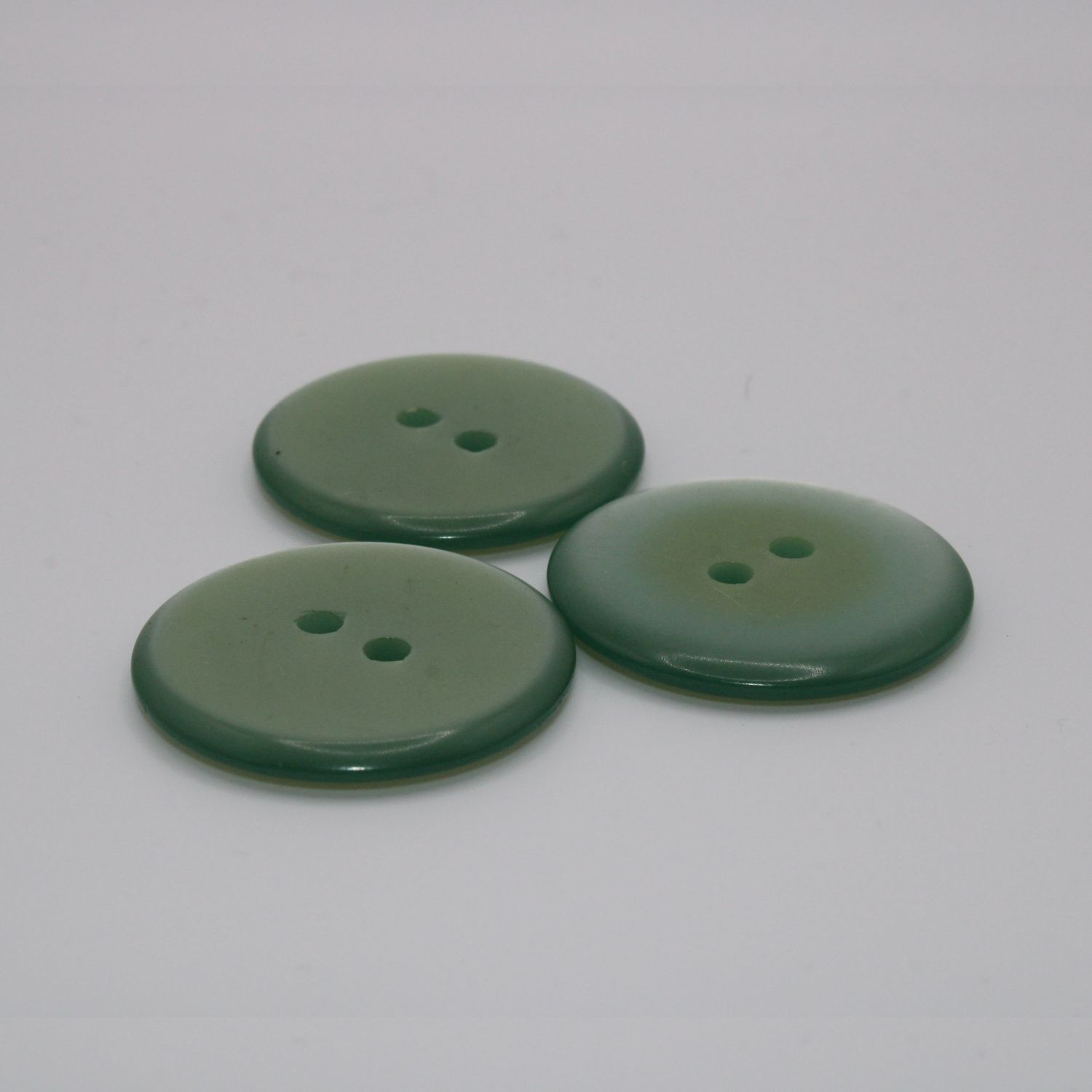 Set van 3 groenblauwe knopen