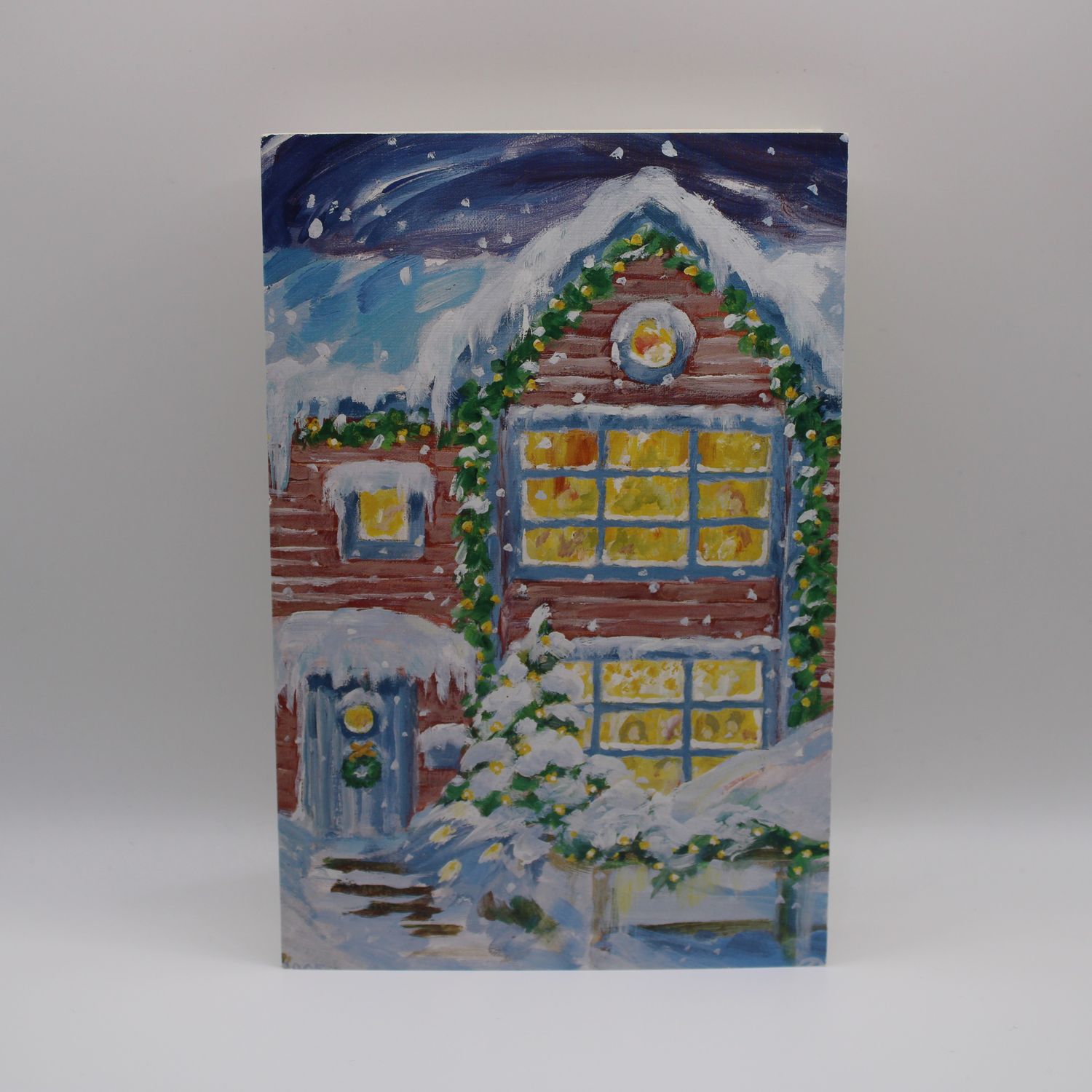 Kaartje met besneeuwd huis