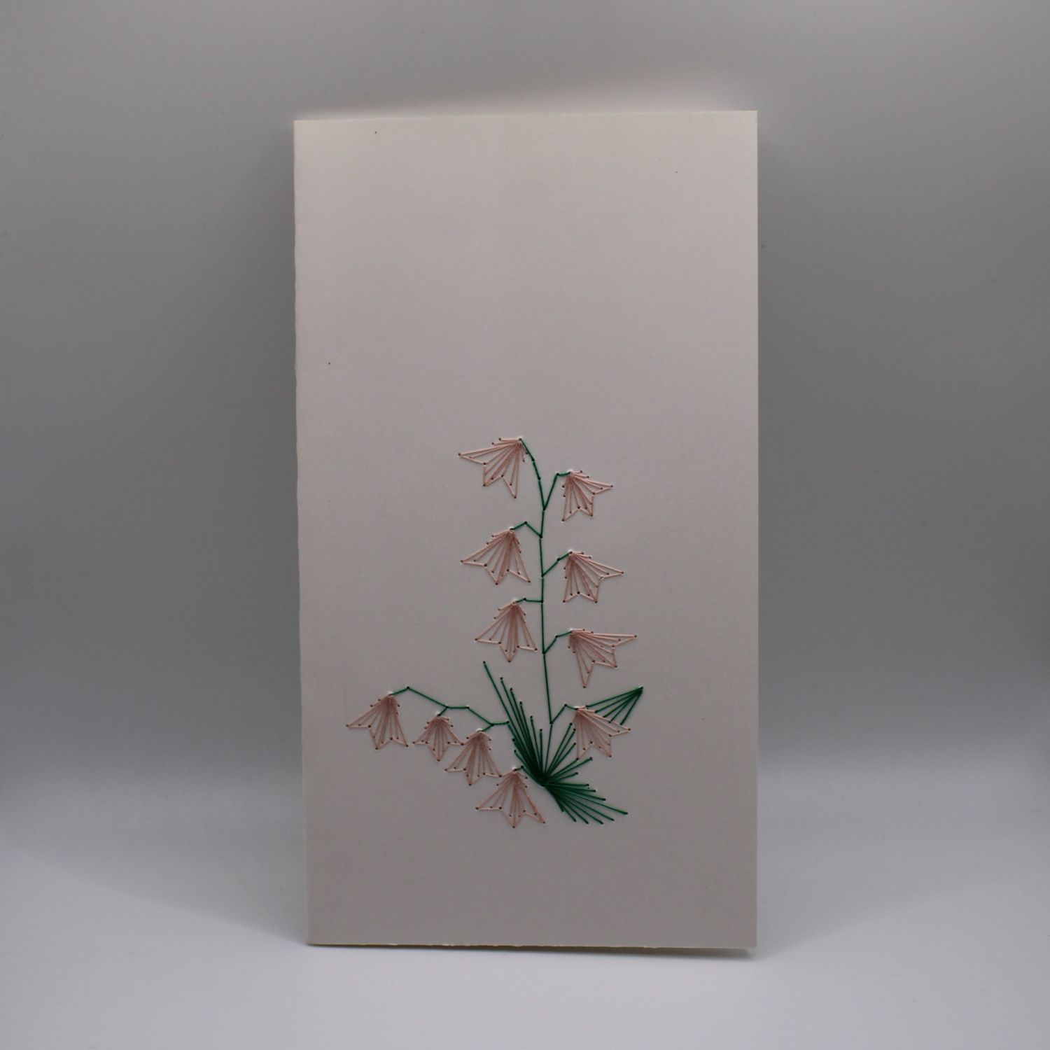 Kaartje met geborduurde bloemen