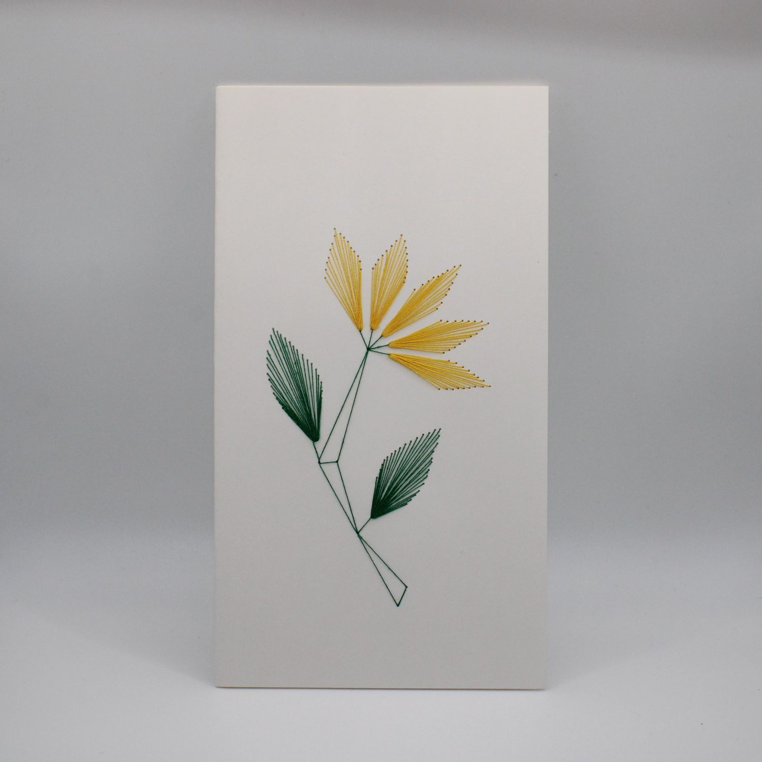 Kaartje met geborduurde bloemen