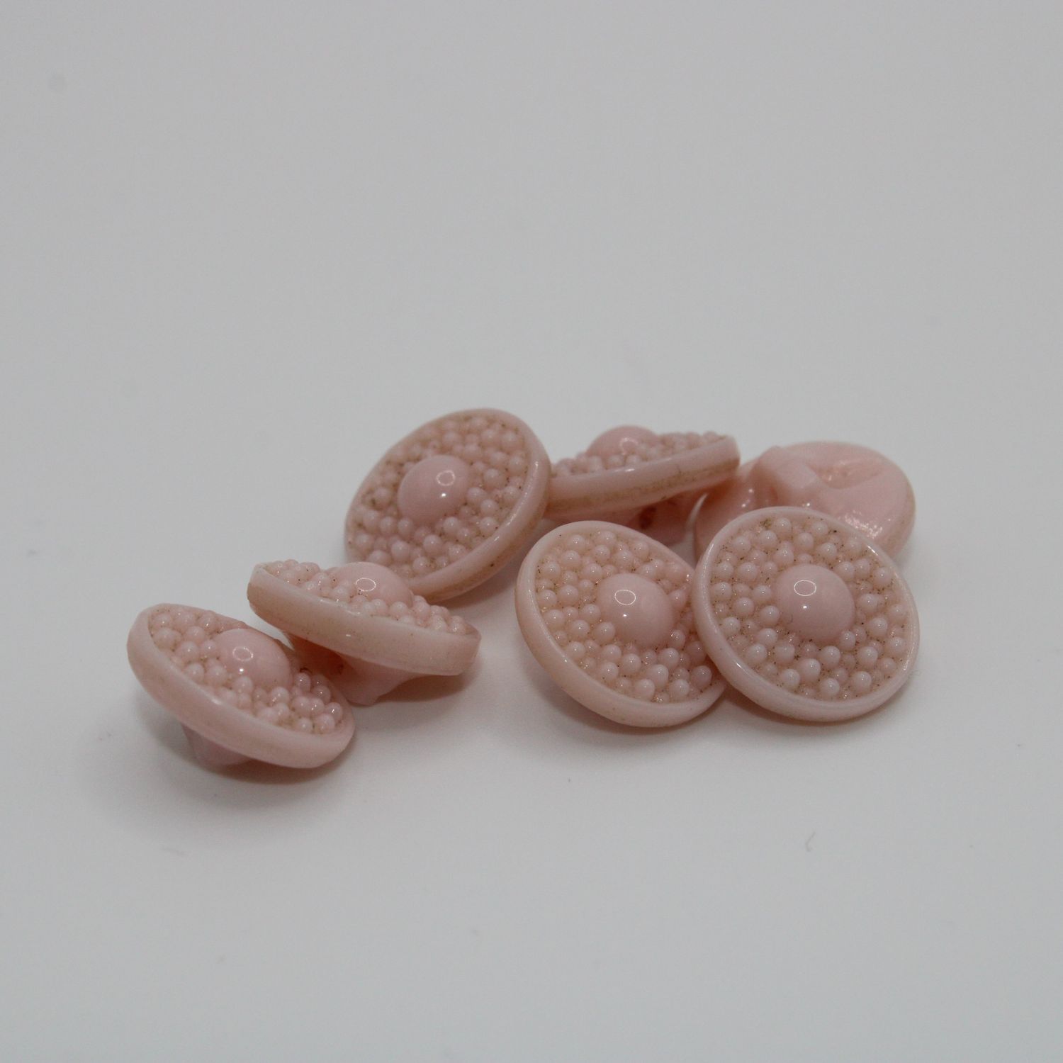 Set van 7 roze knopen