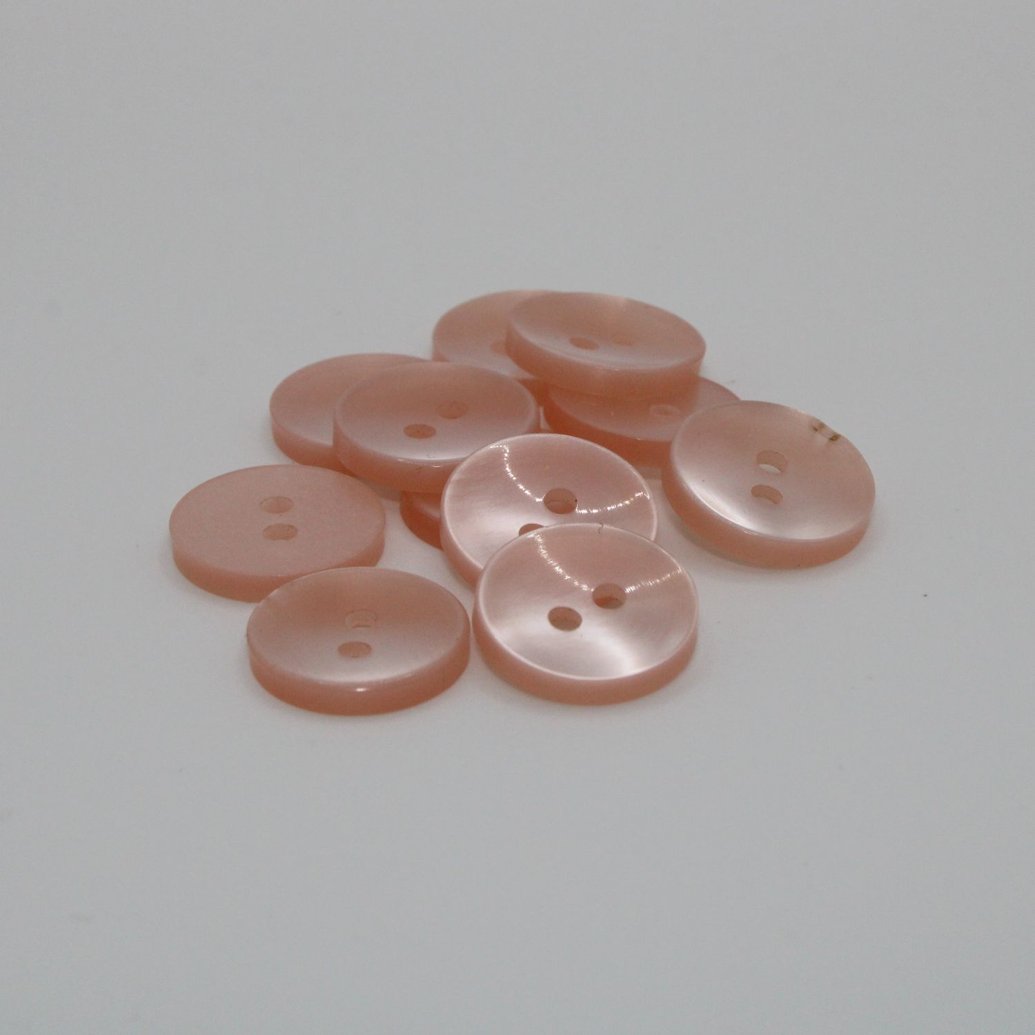 Set van 11 roze knopen