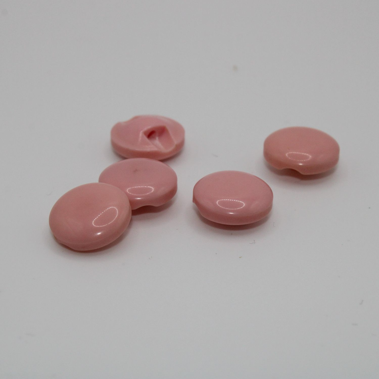 Set van 5 roze knopen