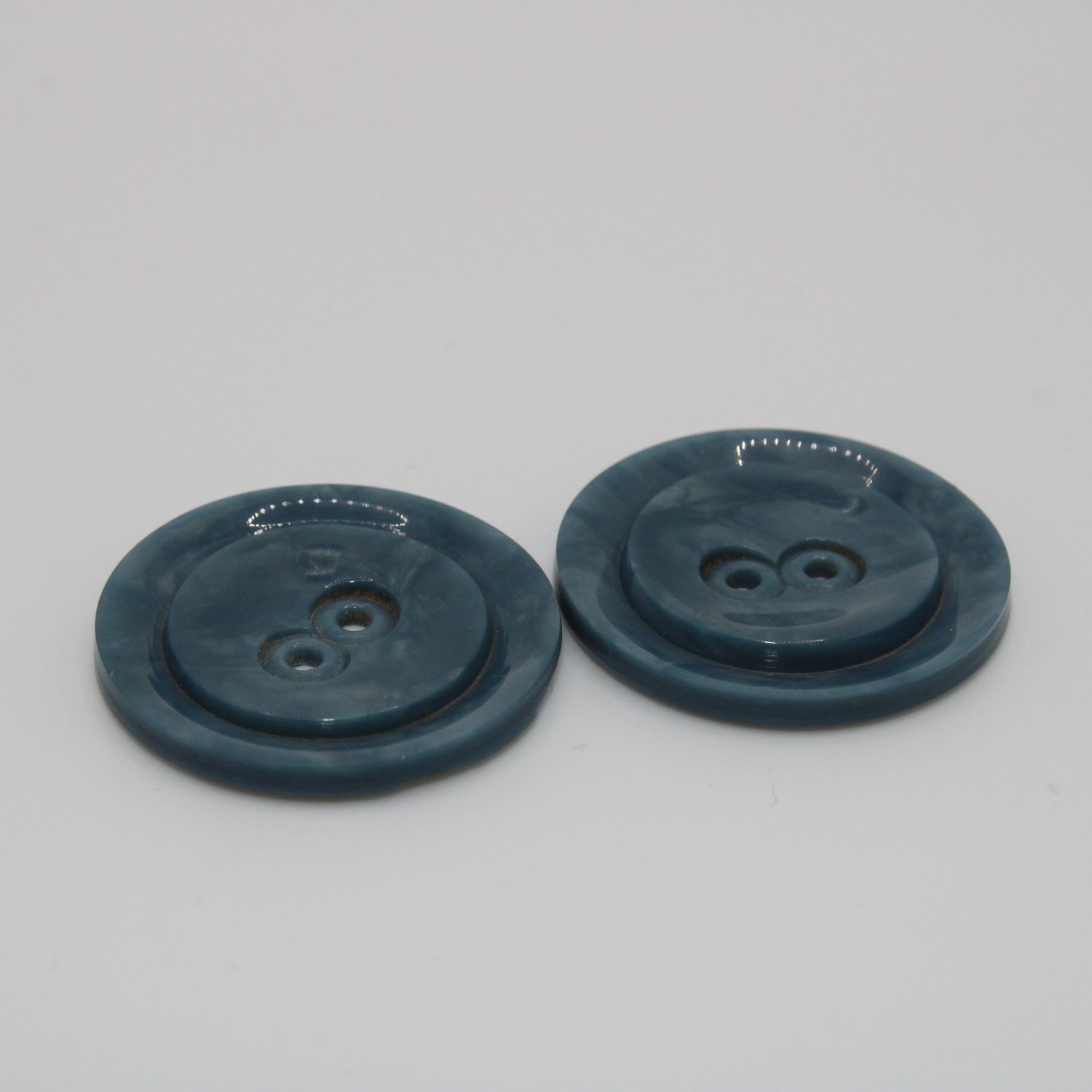 Set van 2 blauwgroene knopen