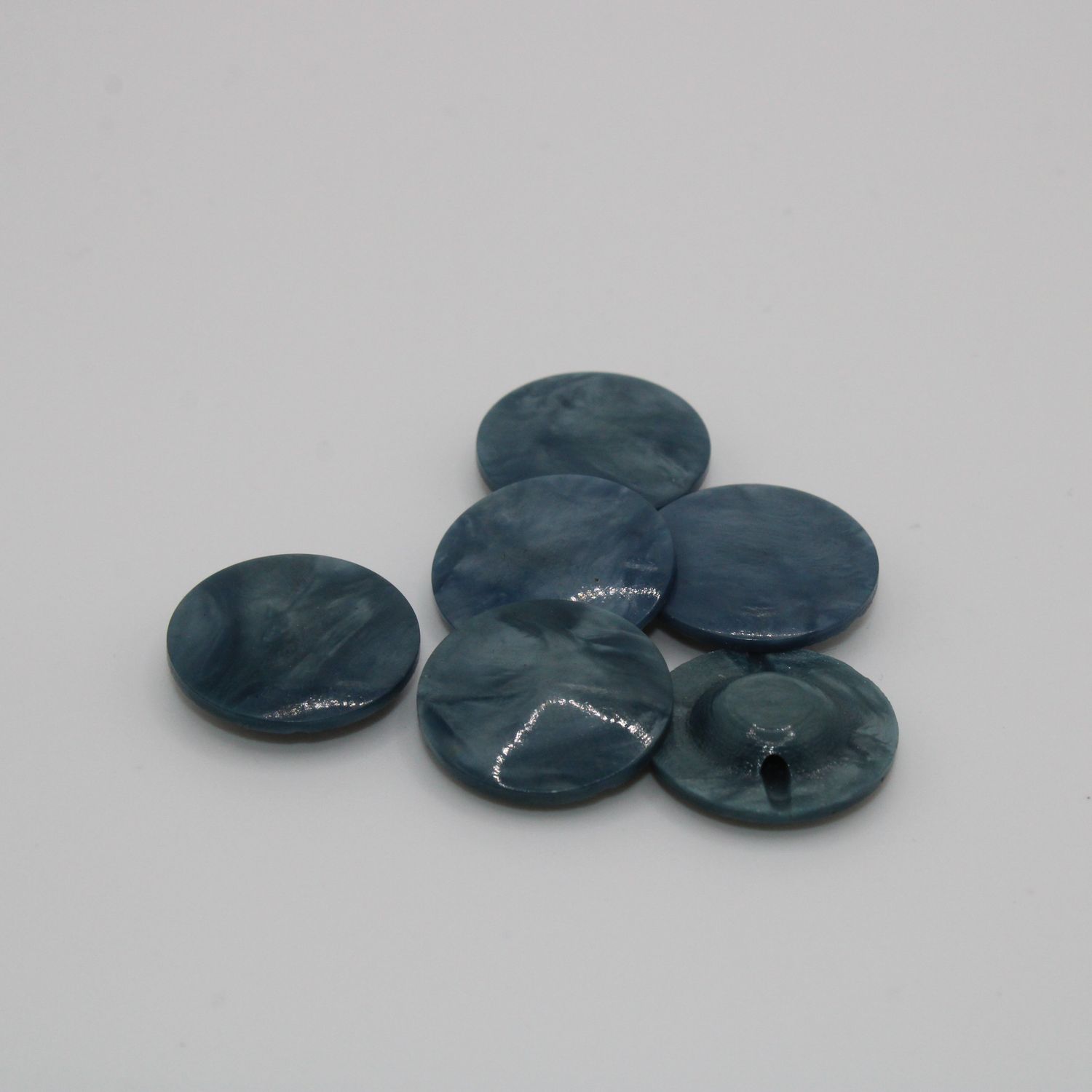 Set van 8 blauwgroene knopen
