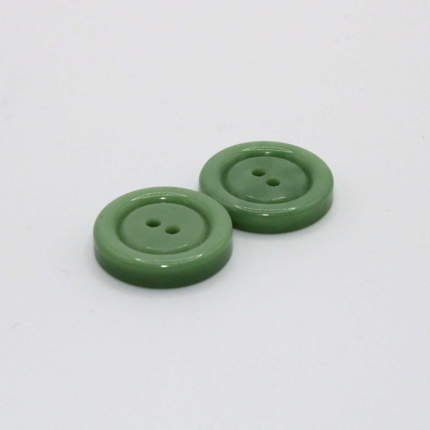 Set van 2 groene knopen