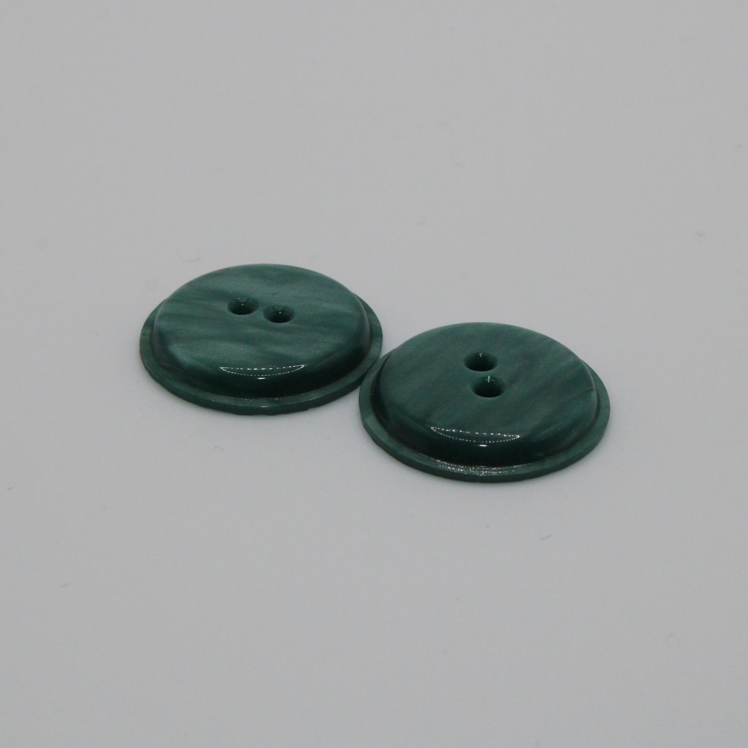 Set van 2 groenblauwe knopen