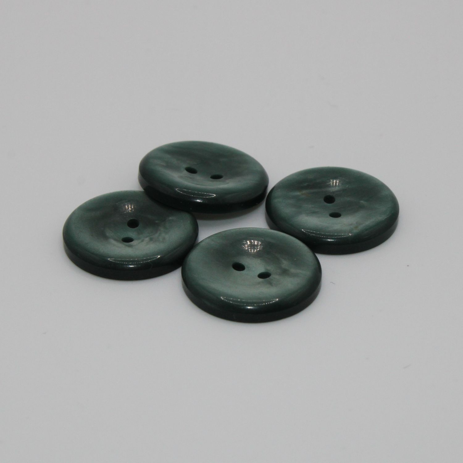 Set van 4 groenblauwe knopen
