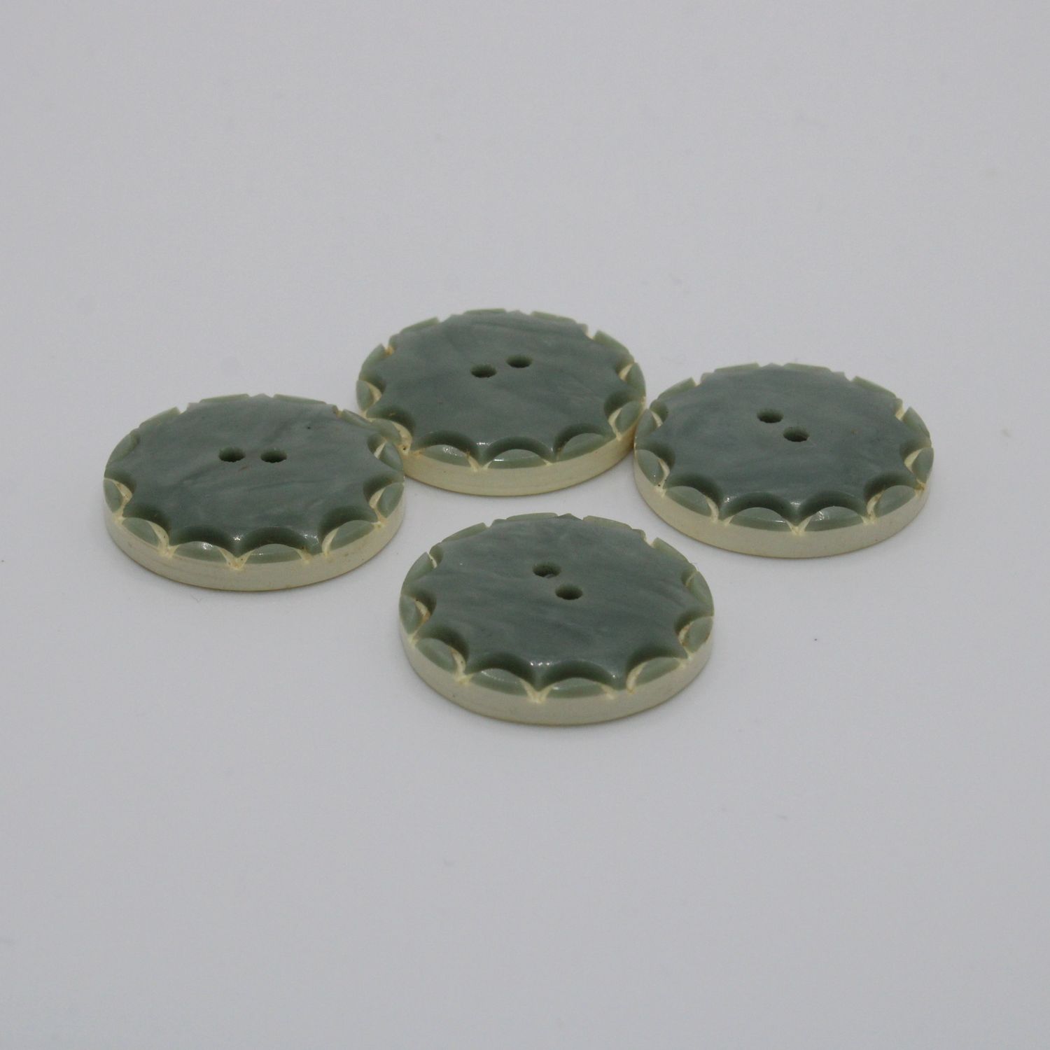 Set van 4 groenblauwe knopen