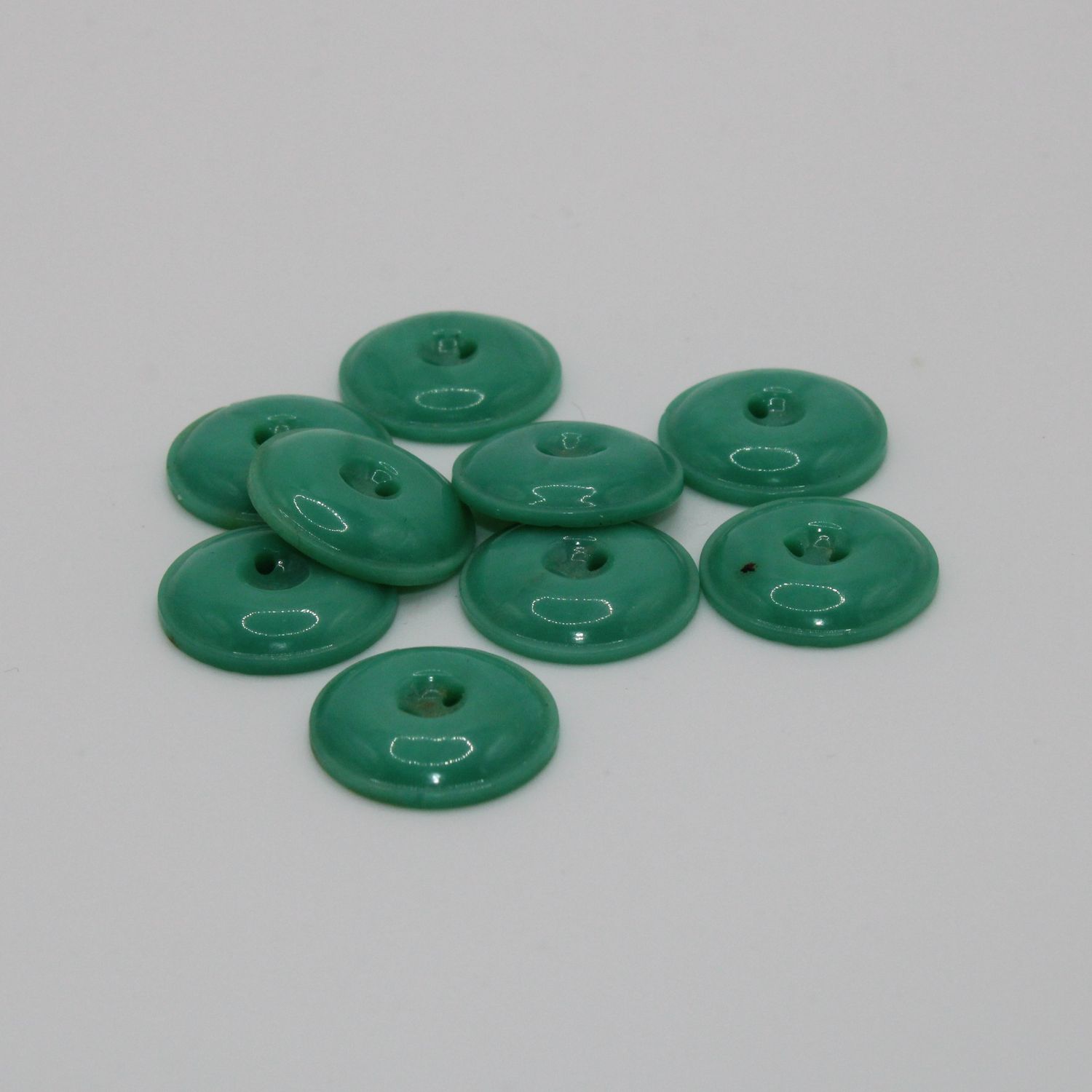 Set van 9 groenblauwe knopen
