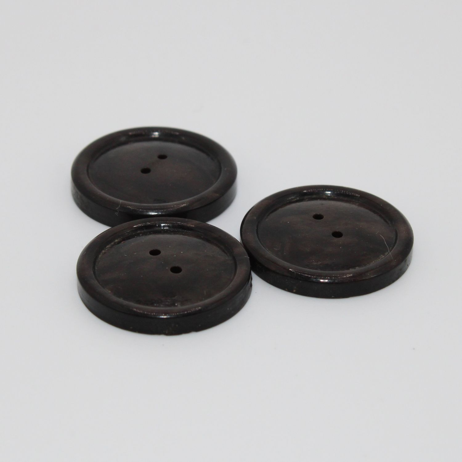 Set van 3 donkerbruine knopen