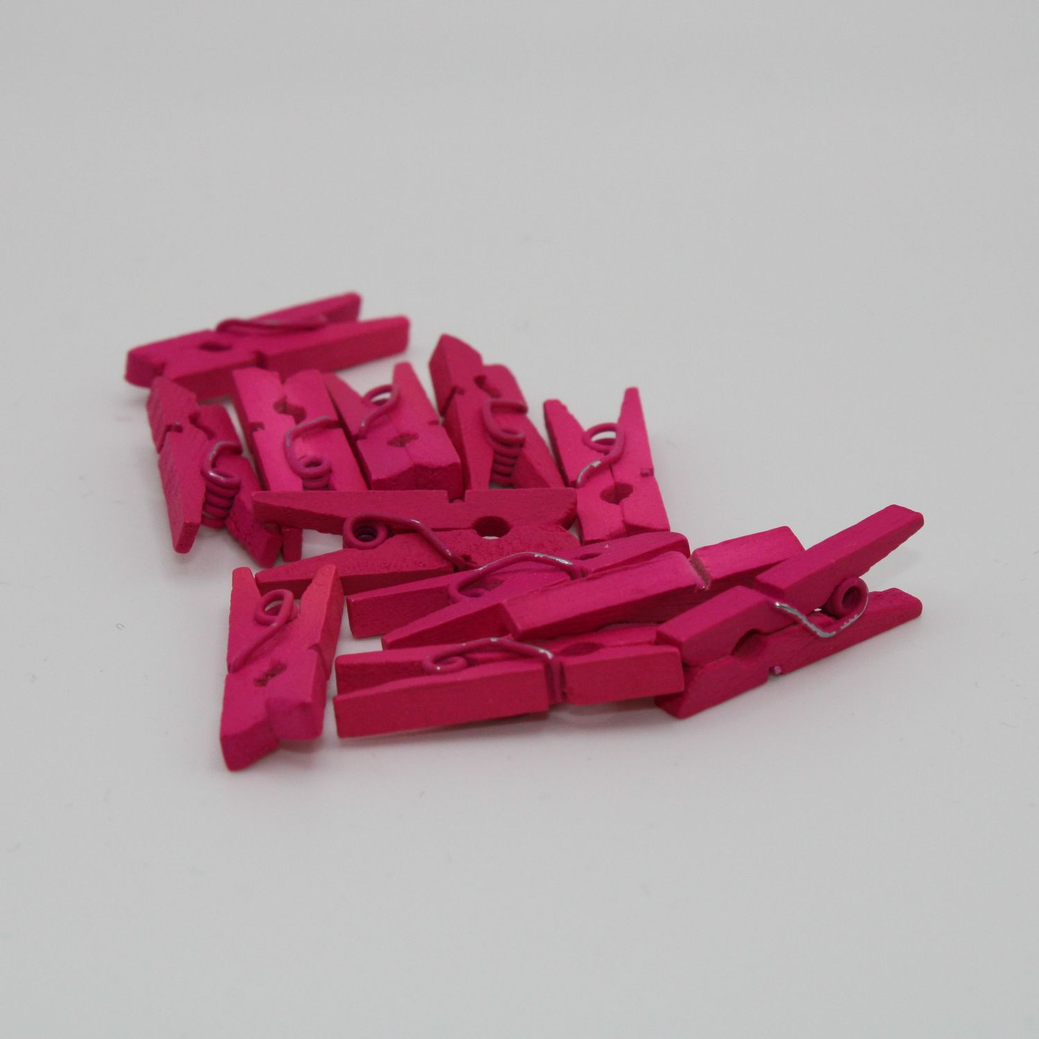 Set van 12 roze wasknijpers