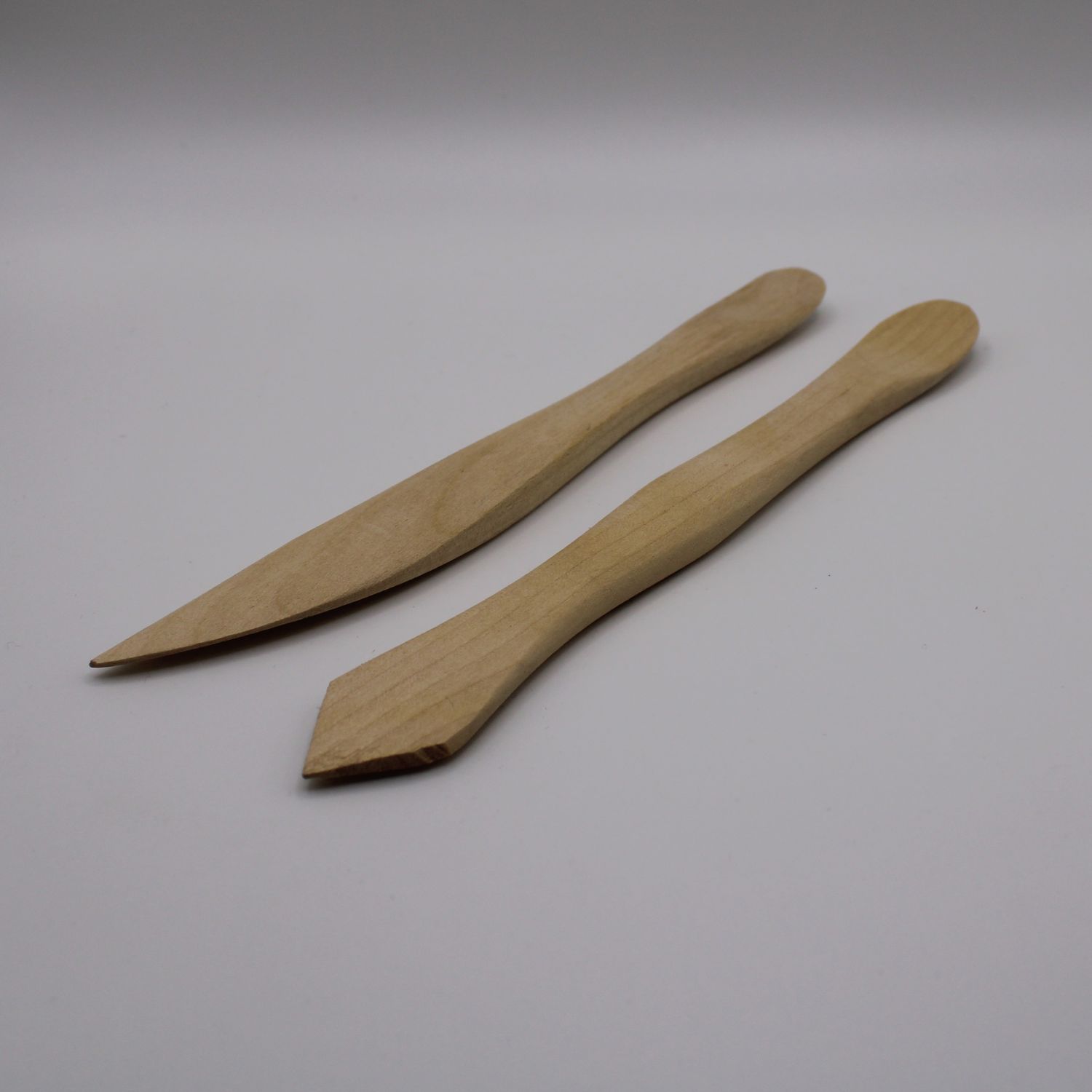 2 boetseerhoutjes