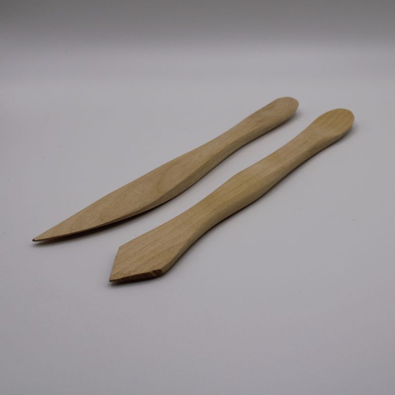 2 boetseerhoutjes