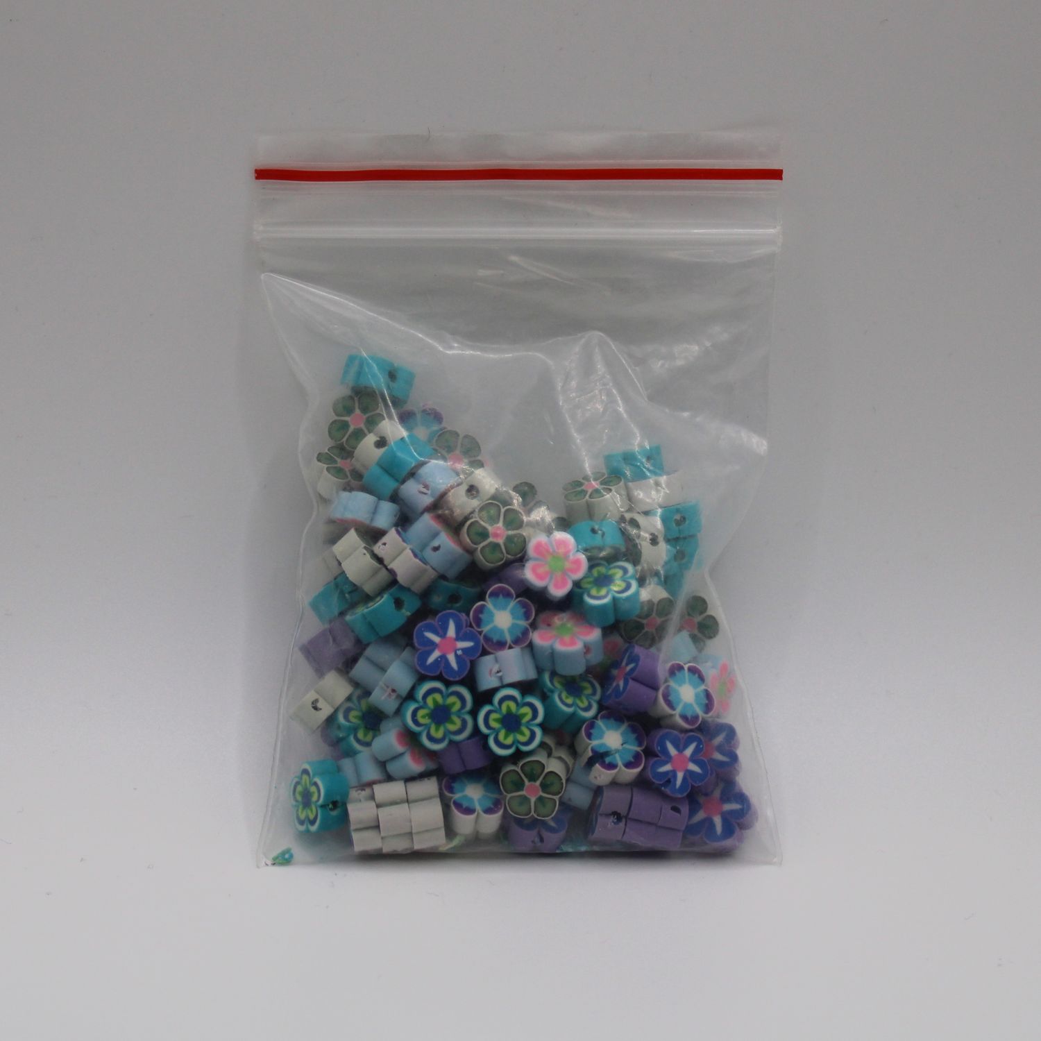 Zakje bloemvormige kralen