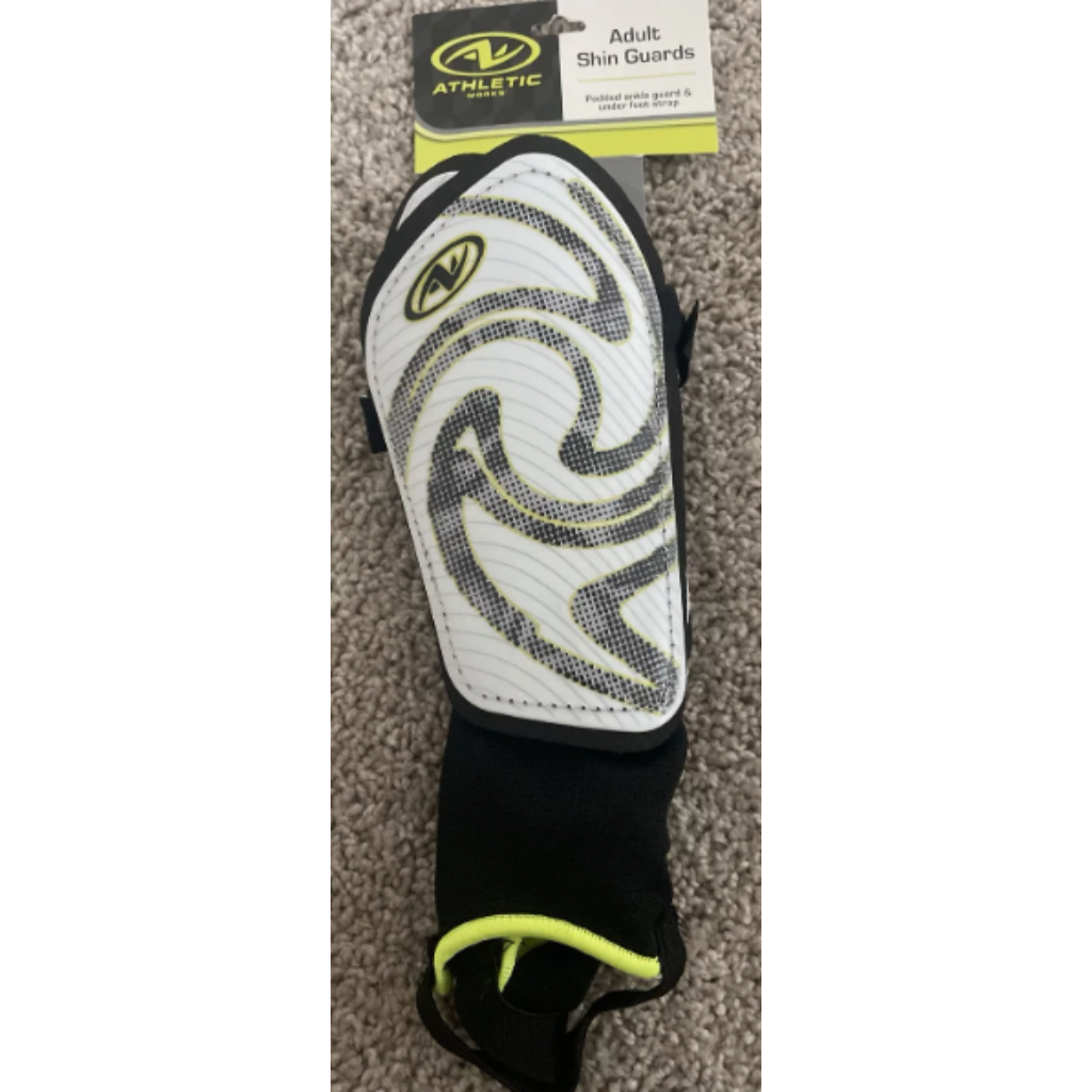 White/black soccer shin guards with stirrup strap and padded ankle guards for secure, all-position play. Brand new with tags.