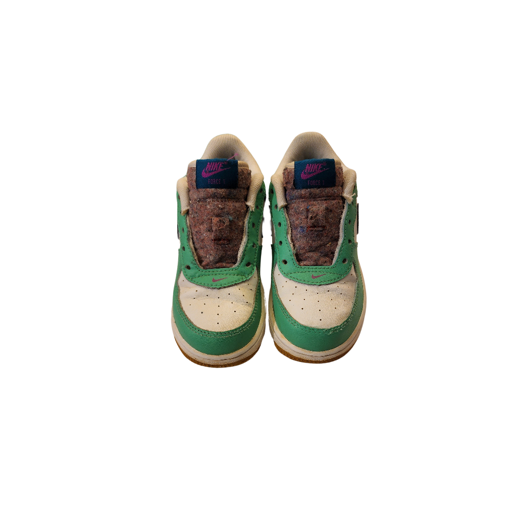 Side view of Nike AF1 LV8 &quot;Play Edition&quot; shoes in white, green, and blue with &quot;Play&quot; and Nike logo on the back.