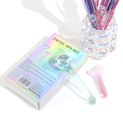 A holographic box labeled “Facial Spa Set” containing two glass-like cooling globes—one pink and one blue—designed for facial massage and skincare treatments.