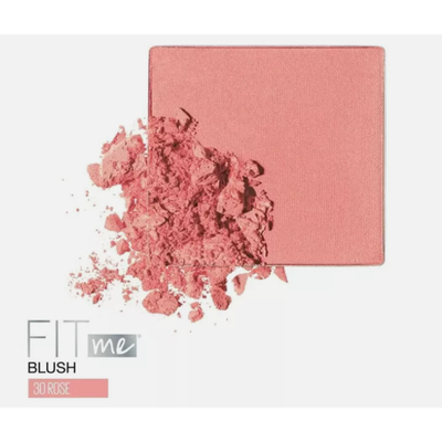 A black compact of Maybelline New York Fit Me Blush in Rose displayed alongside a lightly crushed pink powder, highlighting its soft, natural hue.