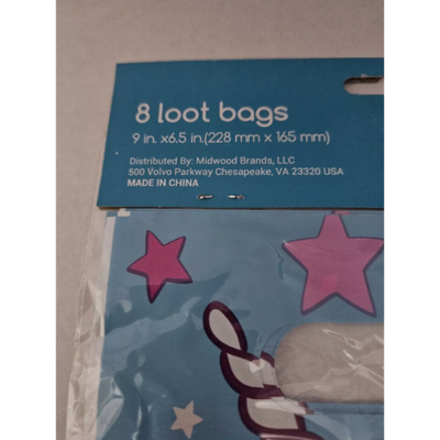 "Eight colorful unicorn-themed loot bags featuring magical designs, perfect for birthday parties and celebrations."
