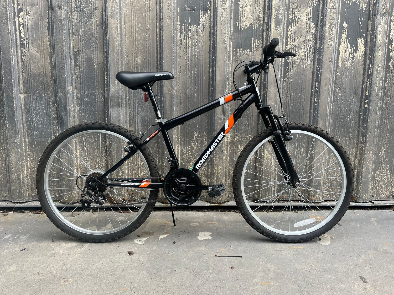 used Roadmaster Granite Peak, black/orange/white, as-is