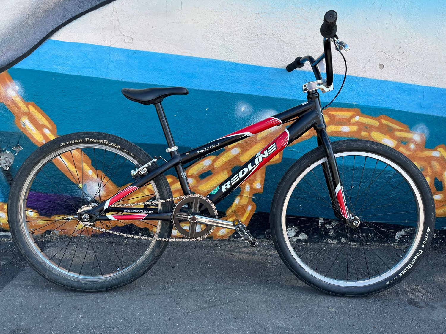 used Redline Proline Pro 24, black/red/white, 24&quot; wheel