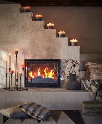 Hoe breng je sfeer in je woonkamer met kandelaars?