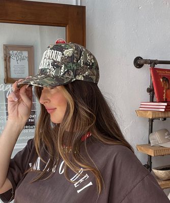 Cast Your Cares Camo Trucker