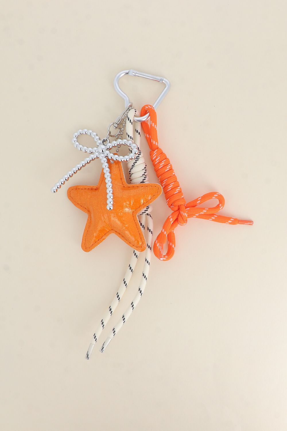 SLEUTELHANGER- BAG CHARMS STER ORANJE