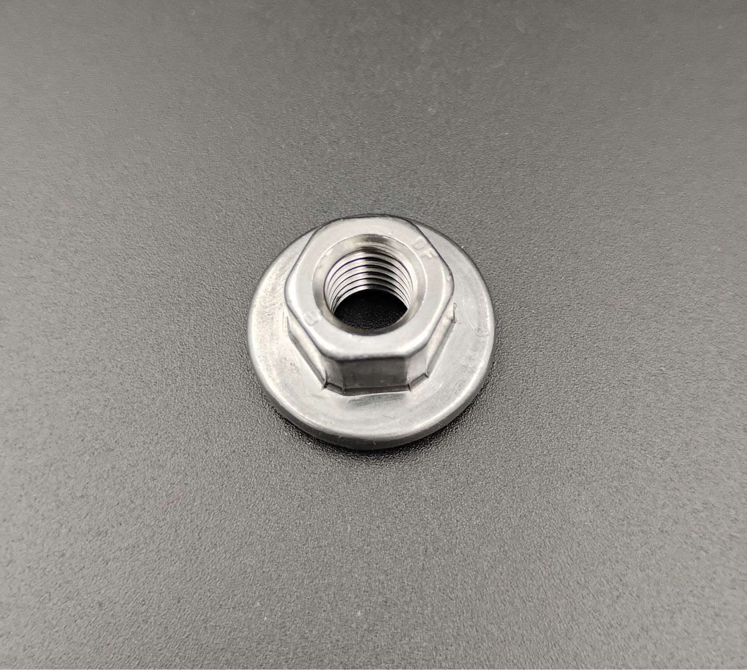 W520752-S300, M8-1.25 Hex Flange Weld Nut, Plain with lube finish, Top view showing Hex and Flange