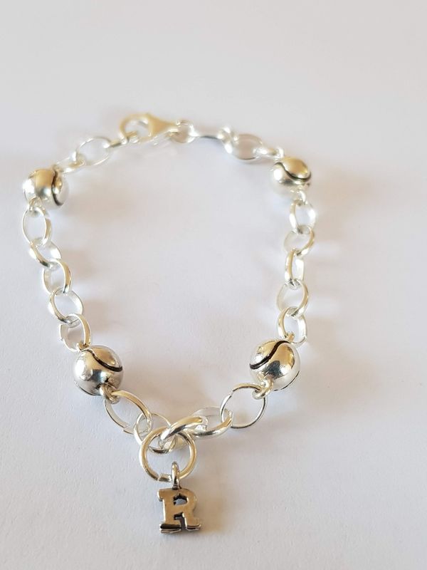 Silver bracelet with 4 tennis balls