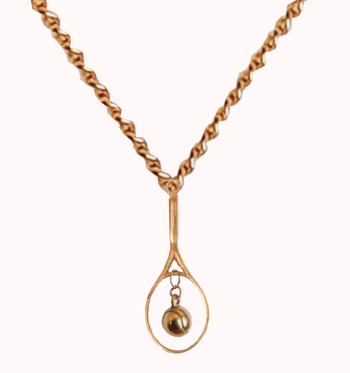 9 ct gold chain with gold tennis racquet with a hanging  gold tennis ball