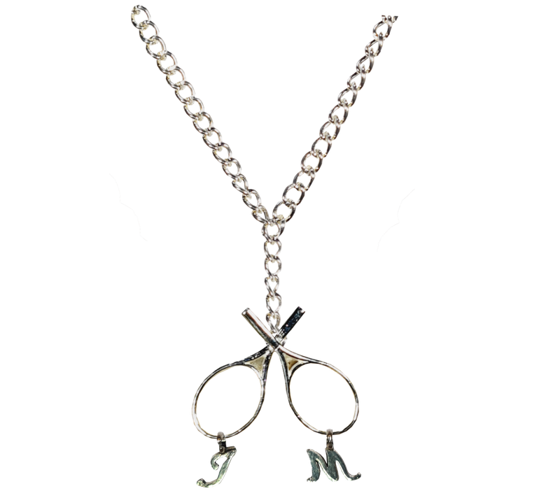 Silver crossed tennis raquet with letters J and M