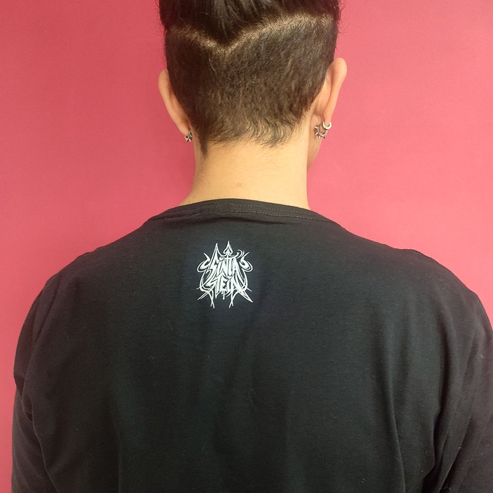 sinta stein logo in white on the back side of the BLACK tee. the YELLOW tee includes the logo in purple.