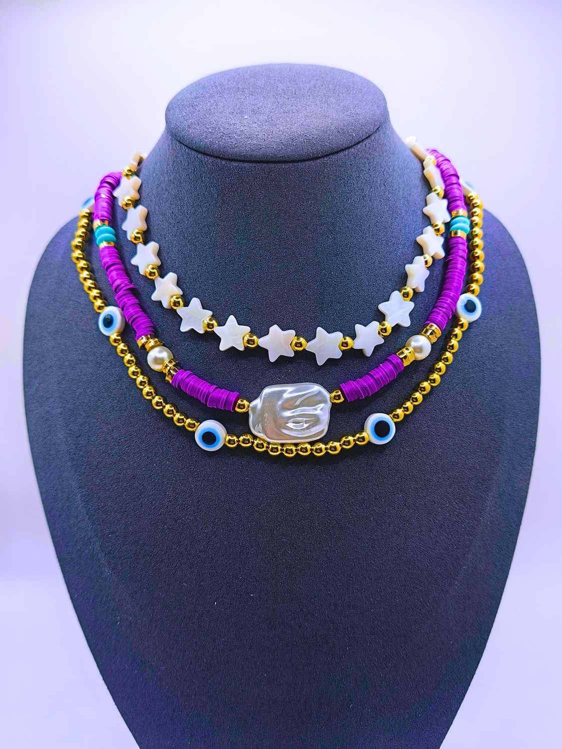 Collar Plástico Triple Calenbi Bohemio Purpura Estrellas y Ojo Turco