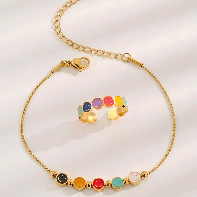 Anillo y Pulsera Acero Titanio Calenbi Carita Feliz Chapa Oro 10k