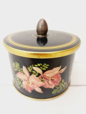 Vintage blik Cote d'Or, rond, zwart met bloemendecoratie en gouden randen