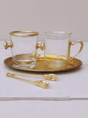 Vintage roomstel voor melk en suiker in glas en goud met handjesgrijper