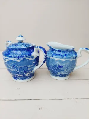 Roomstel voor melk en suiker met landelijk decor blauw wit porselein