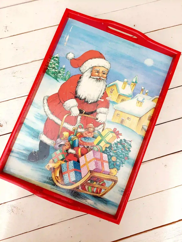 Vintage dienblad in rood hout met tekening van kerstman achter slee