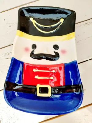 Notenkraker bord - vrolijk kerstservies - rood of blauw