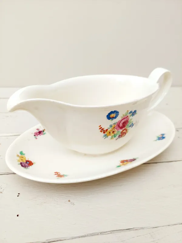 Vintage sauskom - sauspot Petrus Regout Boudewijn - crème porselein met bont bloemendecor