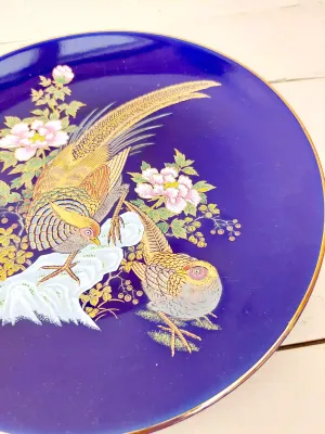 Vintage kobaltblauw sierbord met vogel en goudrand, 21,5 cm