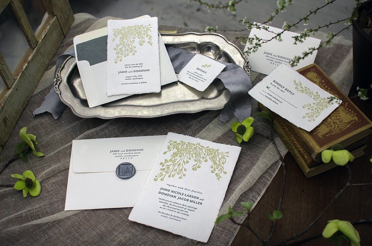 Samples of wedding invitations, save the dates, handmade papers, and letterpress