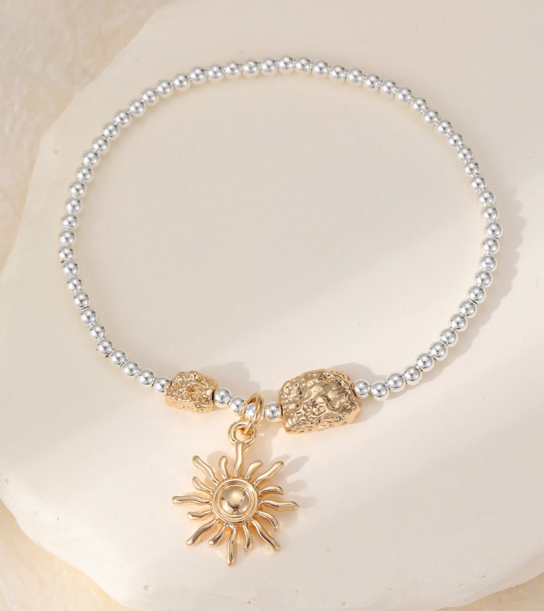 Contemporary Sun Design Silver And Gold Charm Bracelet