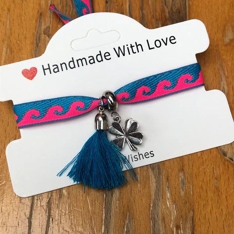 Lintarmband met klavertje vier